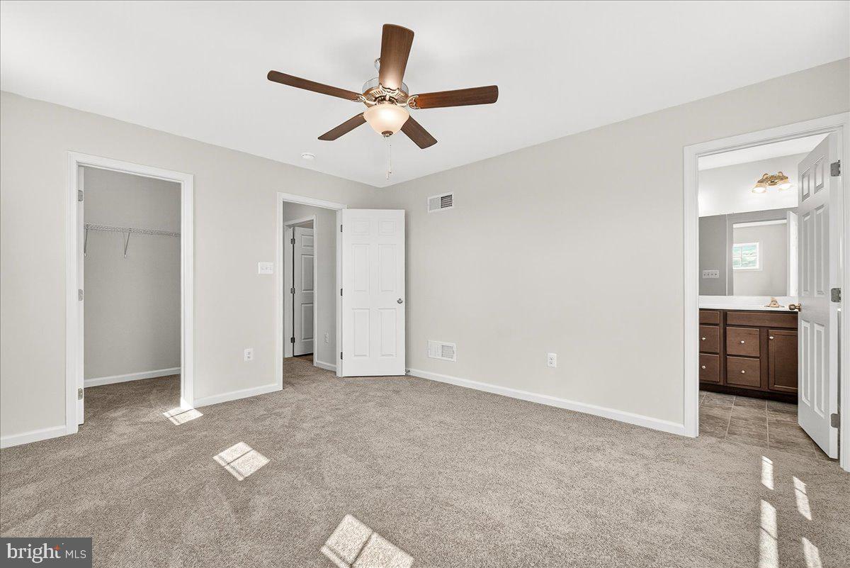 1600 Corn Crib Place Frederick, MD 21702 - Photo 23 of 38 a view of a livingroom with a ceiling fan and entryway