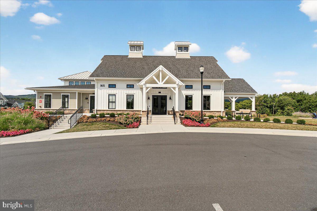 1600 Corn Crib Place Frederick, MD 21702 - Photo 35 of 38 a front view of a house with a yard