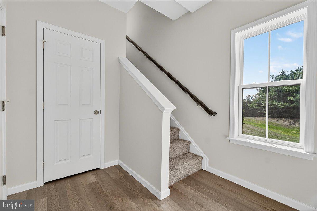 1600 Corn Crib Place Frederick, MD 21702 - Photo 5 of 38 a view of entryway with wooden floor and stairs