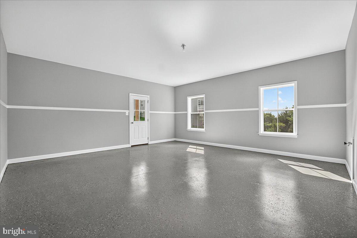 1600 Corn Crib Place Frederick, MD 21702 - Photo 8 of 38 a view of a livingroom with wooden floor and window
