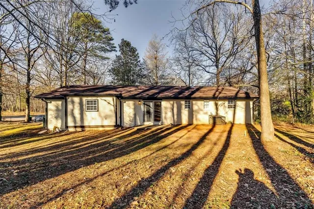 a view of a house with a small yard