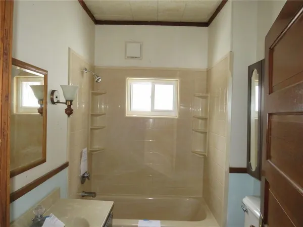 a kitchen with a sink cabinets and window