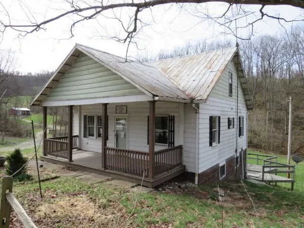 a view of room with hardwood floor and cabinet