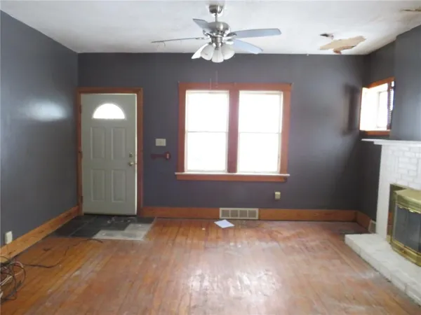 a view of backyard with tub and door