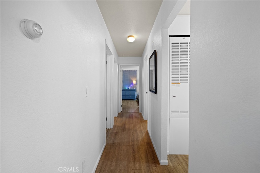 3524 East Avenue R, Unit 121 Palmdale, CA 93550 - Photo 12 of 40 a view of hallway with wooden floor