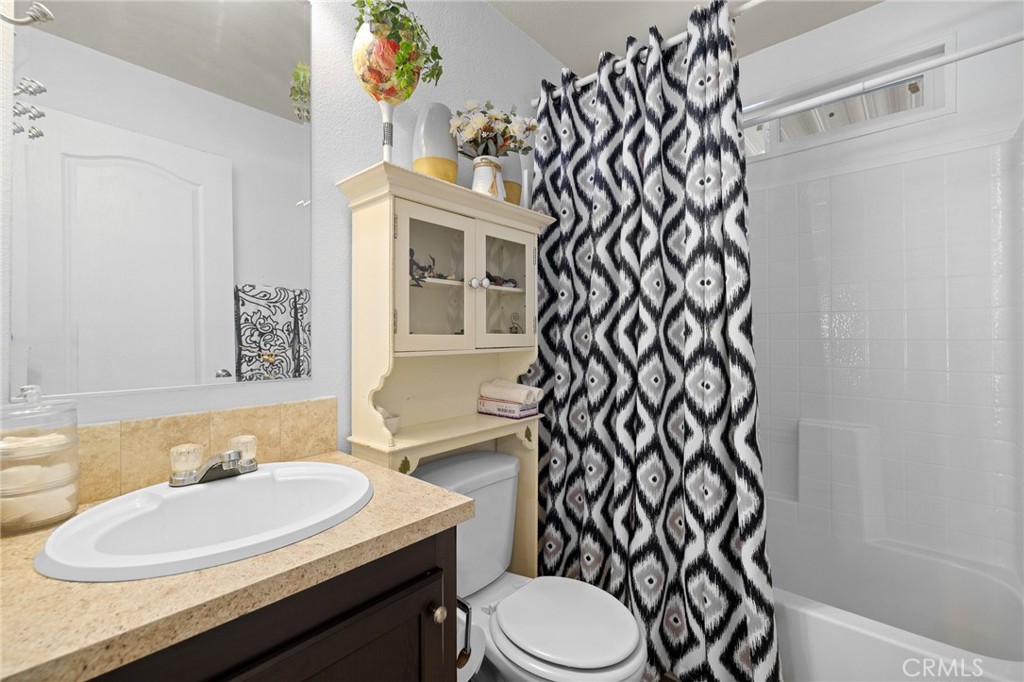 3524 East Avenue R, Unit 121 Palmdale, CA 93550 - Photo 14 of 40 a bathroom with a sink toilet and shower