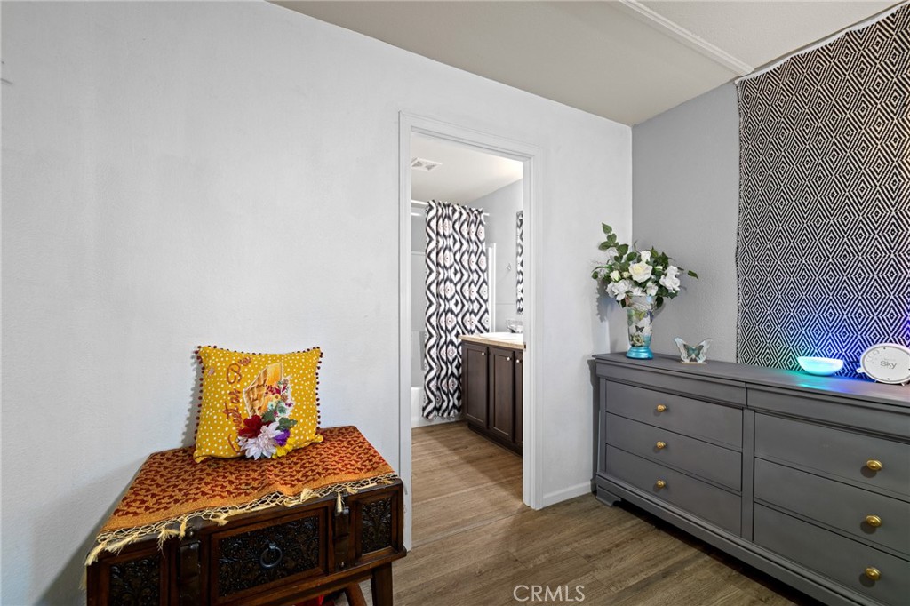 3524 East Avenue R, Unit 121 Palmdale, CA 93550 - Photo 21 of 40 a bedroom with a bed and a table in it