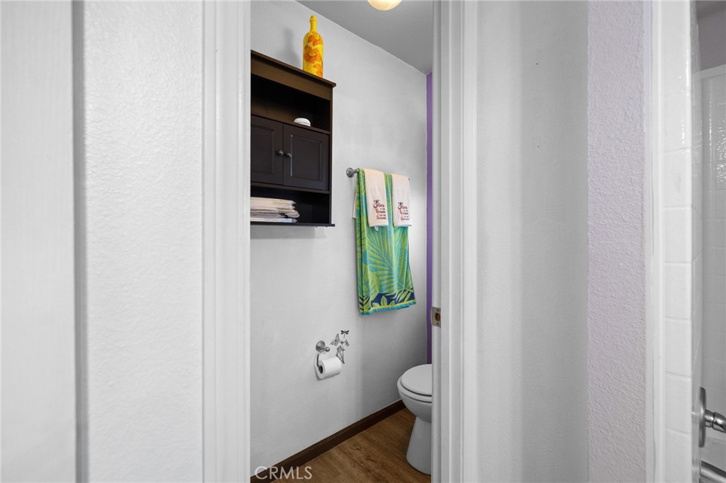 3524 East Avenue R, Unit 121 Palmdale, CA 93550 - Photo 23 of 40 a bathroom with a granite countertop toilet and a sink