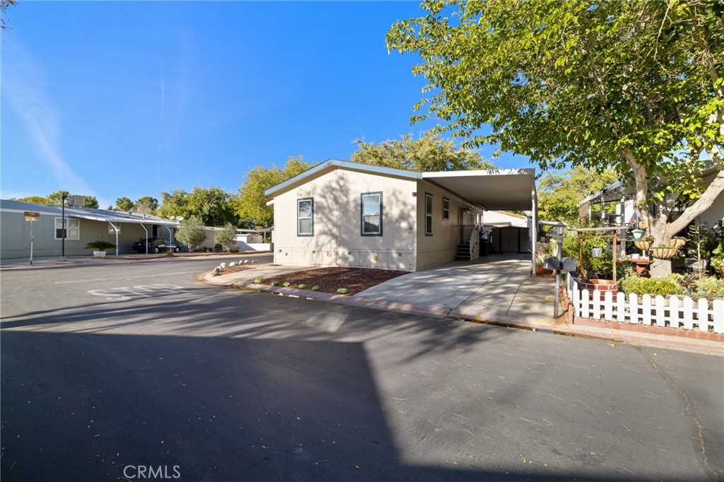 3524 East Avenue R, Unit 121 Palmdale, CA 93550 - Photo 24 of 40 a view of a house with a yard