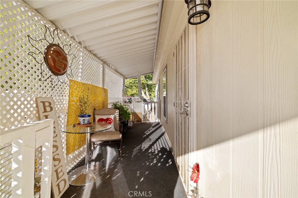 3524 East Avenue R, Unit 121 Palmdale, CA 93550 - Photo 27 of 40 a living room with furniture and a window