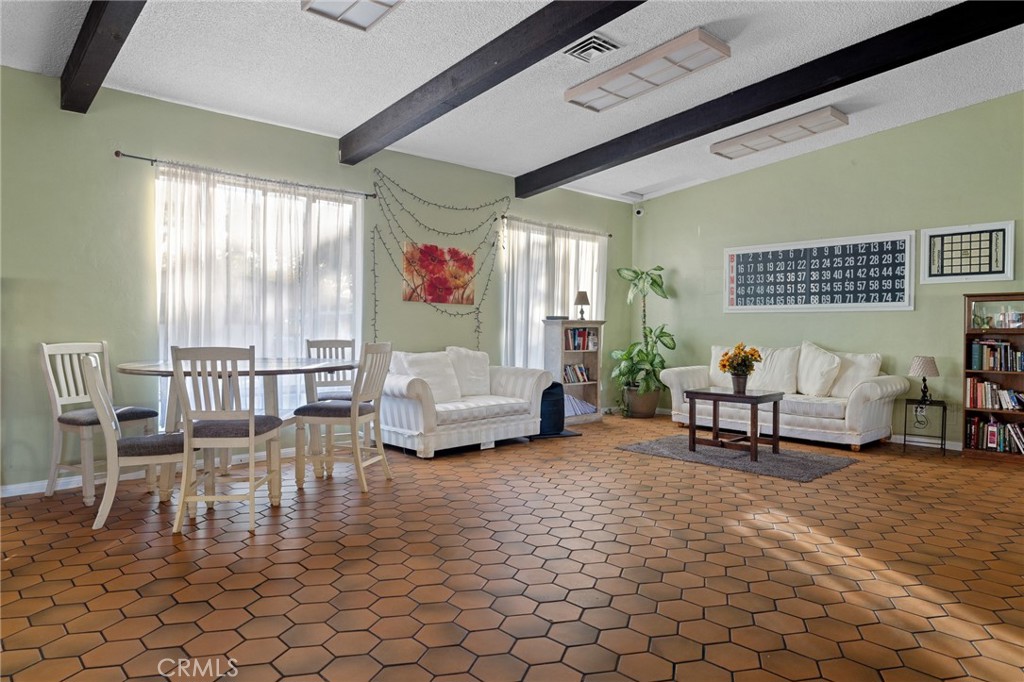 3524 East Avenue R, Unit 121 Palmdale, CA 93550 - Photo 28 of 40 a living room with furniture and a window