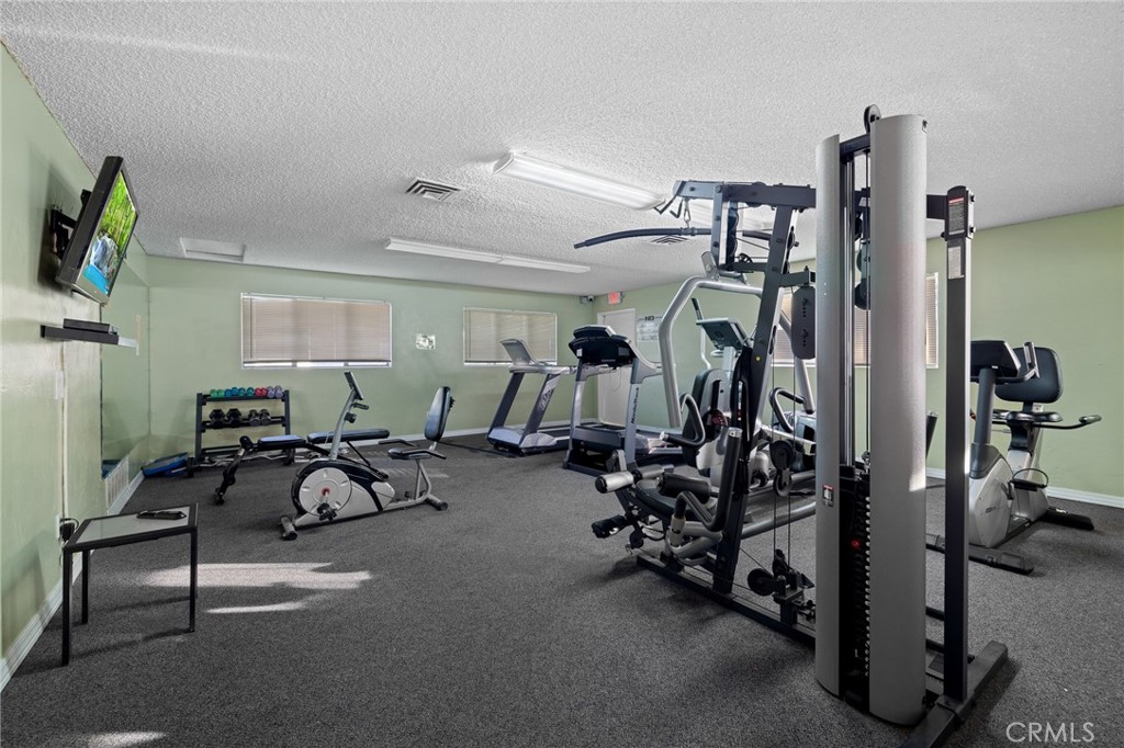 3524 East Avenue R, Unit 121 Palmdale, CA 93550 - Photo 31 of 40 a view of a room with gym equipment