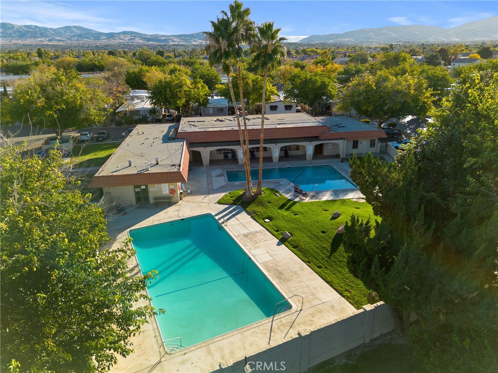 3524 East Avenue R, Unit 121 Palmdale, CA 93550 - Photo 35 of 40 an aerial view of a house with a garden