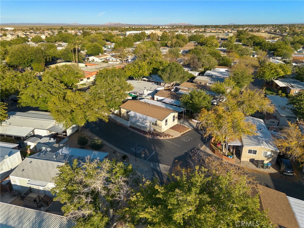 3524 East Avenue R, Unit 121 Palmdale, CA 93550 - Photo 36 of 40 an aerial view of residential houses with outdoor space