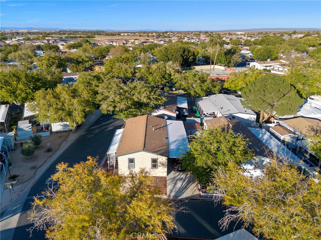 3524 East Avenue R, Unit 121 Palmdale, CA 93550 - Photo 37 of 40 an aerial view of a house with a yard