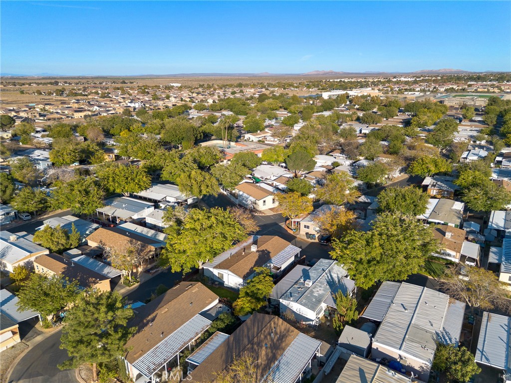 3524 East Avenue R, Unit 121 Palmdale, CA 93550 - Photo 38 of 40 an aerial view of residential houses with outdoor space
