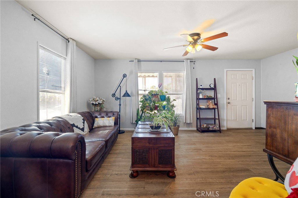 3524 East Avenue R, Unit 121 Palmdale, CA 93550 - Photo 6 of 40 a living room with furniture and a large window
