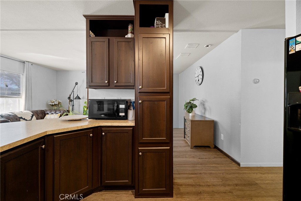 3524 East Avenue R, Unit 121 Palmdale, CA 93550 - Photo 10 of 40 a kitchen with stainless steel appliances granite countertop a refrigerator and a stove