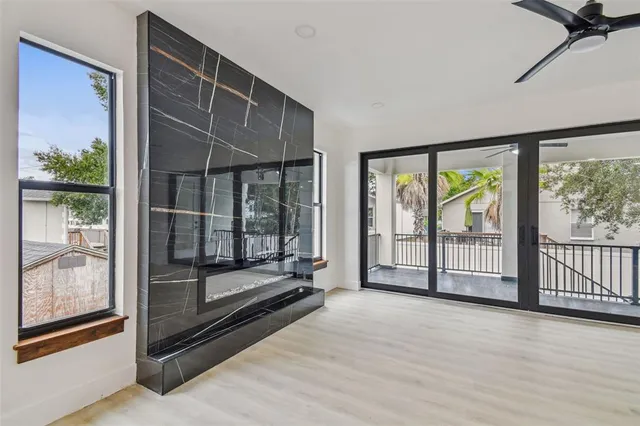 a view of front door and porch with wooden floor