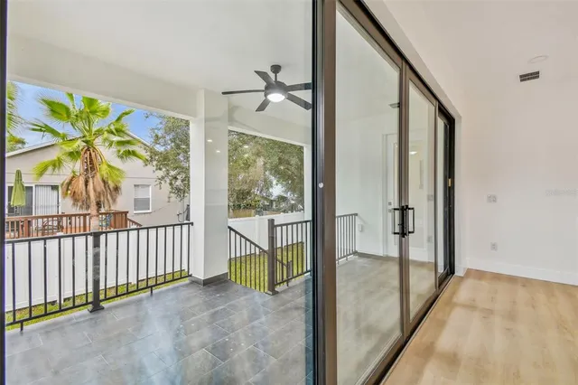 a view of a livingroom with a furniture and a ceiling fan