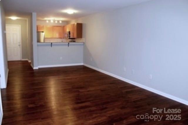 1310 Fleming Road, Unit P Greensboro, NC 27410 - Photo 4 of 12 a view of a kitchen with wooden floor and a sink