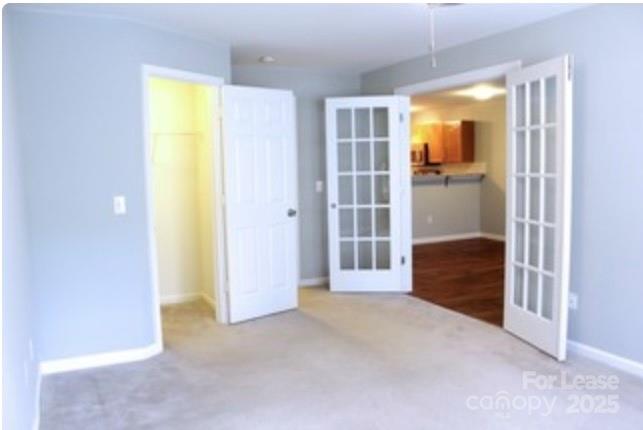 1310 Fleming Road, Unit P Greensboro, NC 27410 - Photo 8 of 12 an empty room with closet and a bathroom
