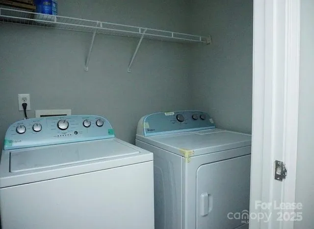 a utility room with dryer and washer