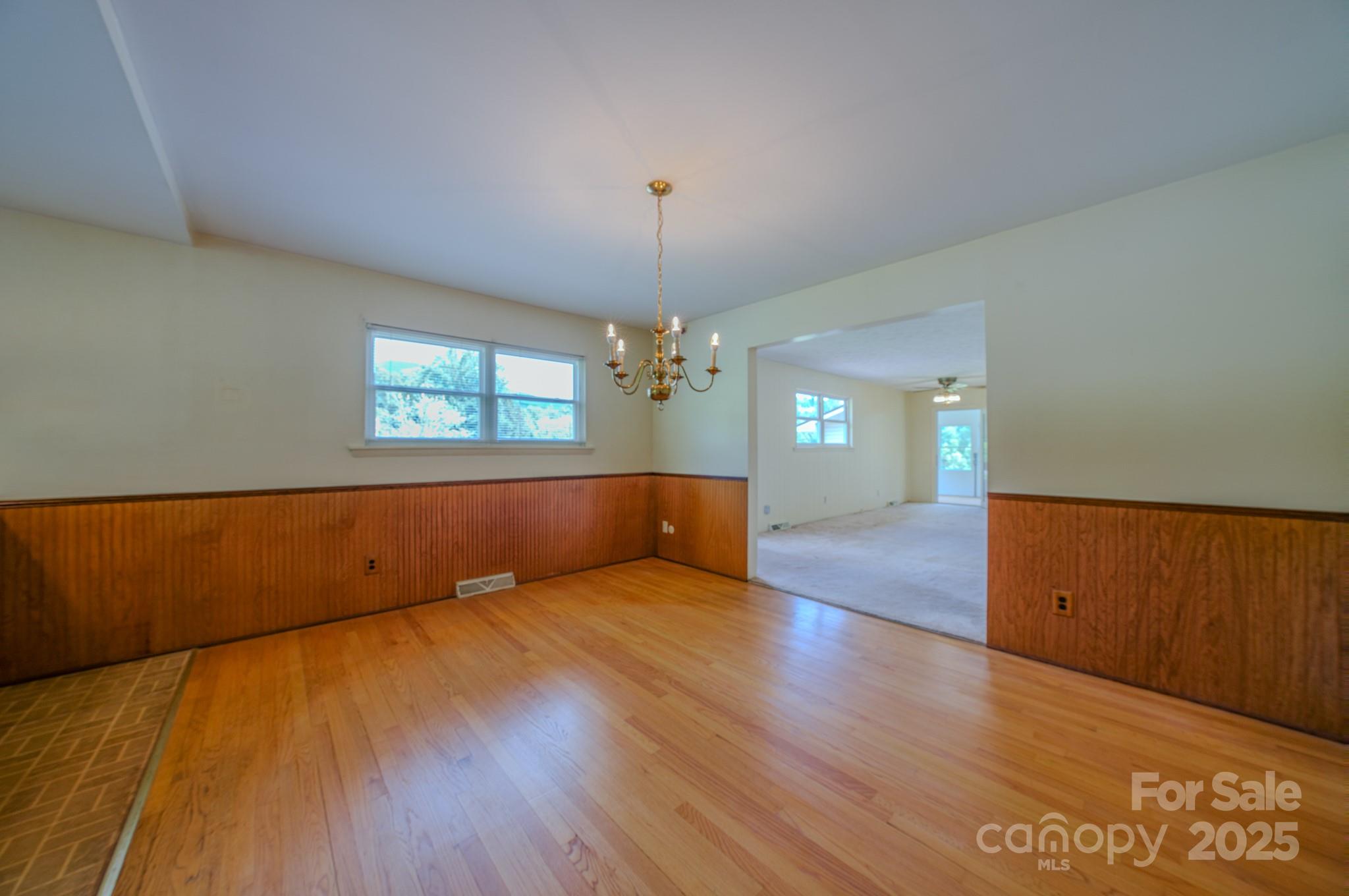26 Big Cove Road Candler, NC 28715 - Photo 14 of 47 a view of wooden floor and windows in a room