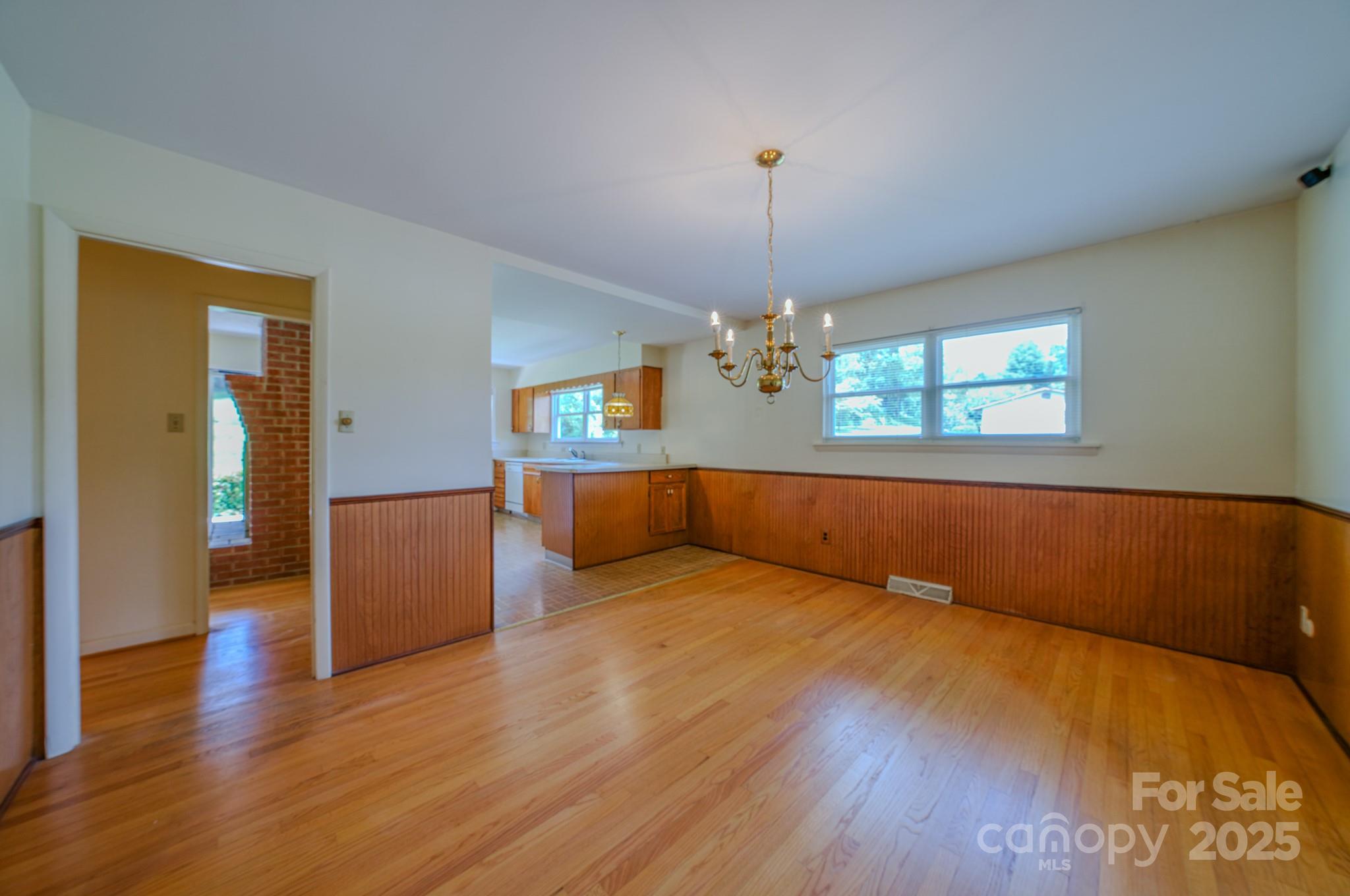 26 Big Cove Road Candler, NC 28715 - Photo 15 of 47 a view of room with window and hardwood floor