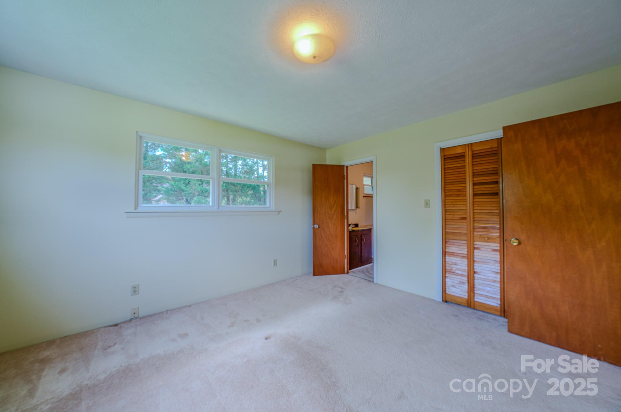 26 Big Cove Road Candler, NC 28715 - Photo 17 of 47 an empty room with windows