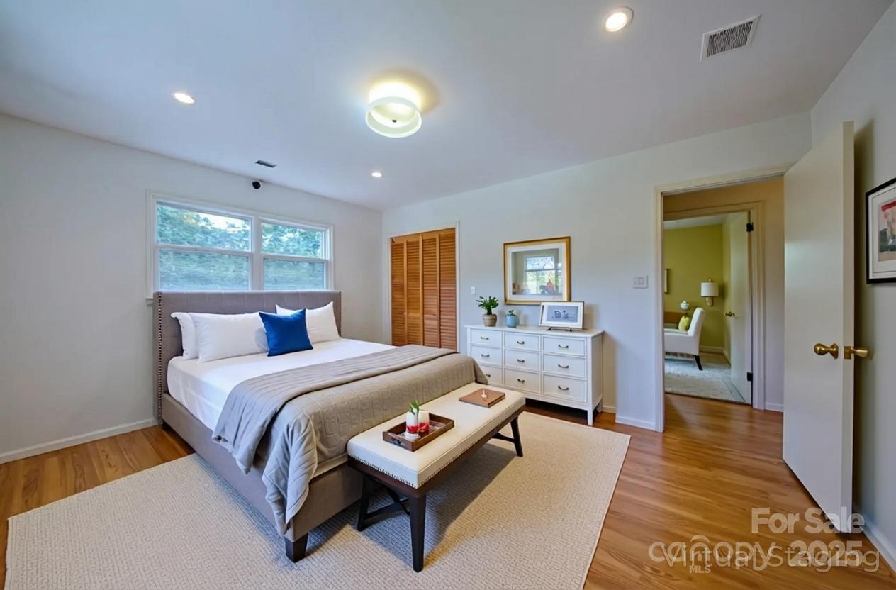 26 Big Cove Road Candler, NC 28715 - Photo 22 of 47 a bed room with a bed and a night stand