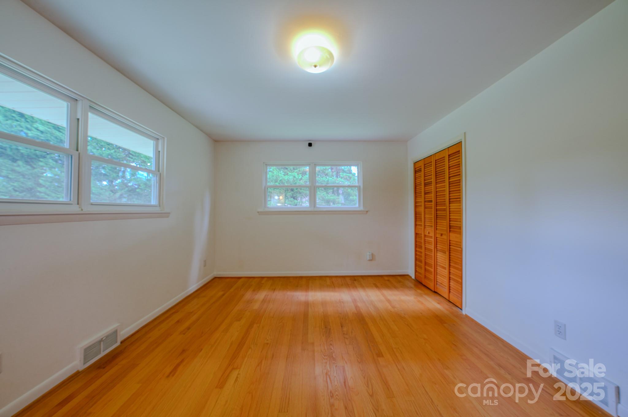 26 Big Cove Road Candler, NC 28715 - Photo 24 of 47 an empty room with windows