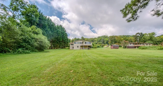 a view of a house with a big yard