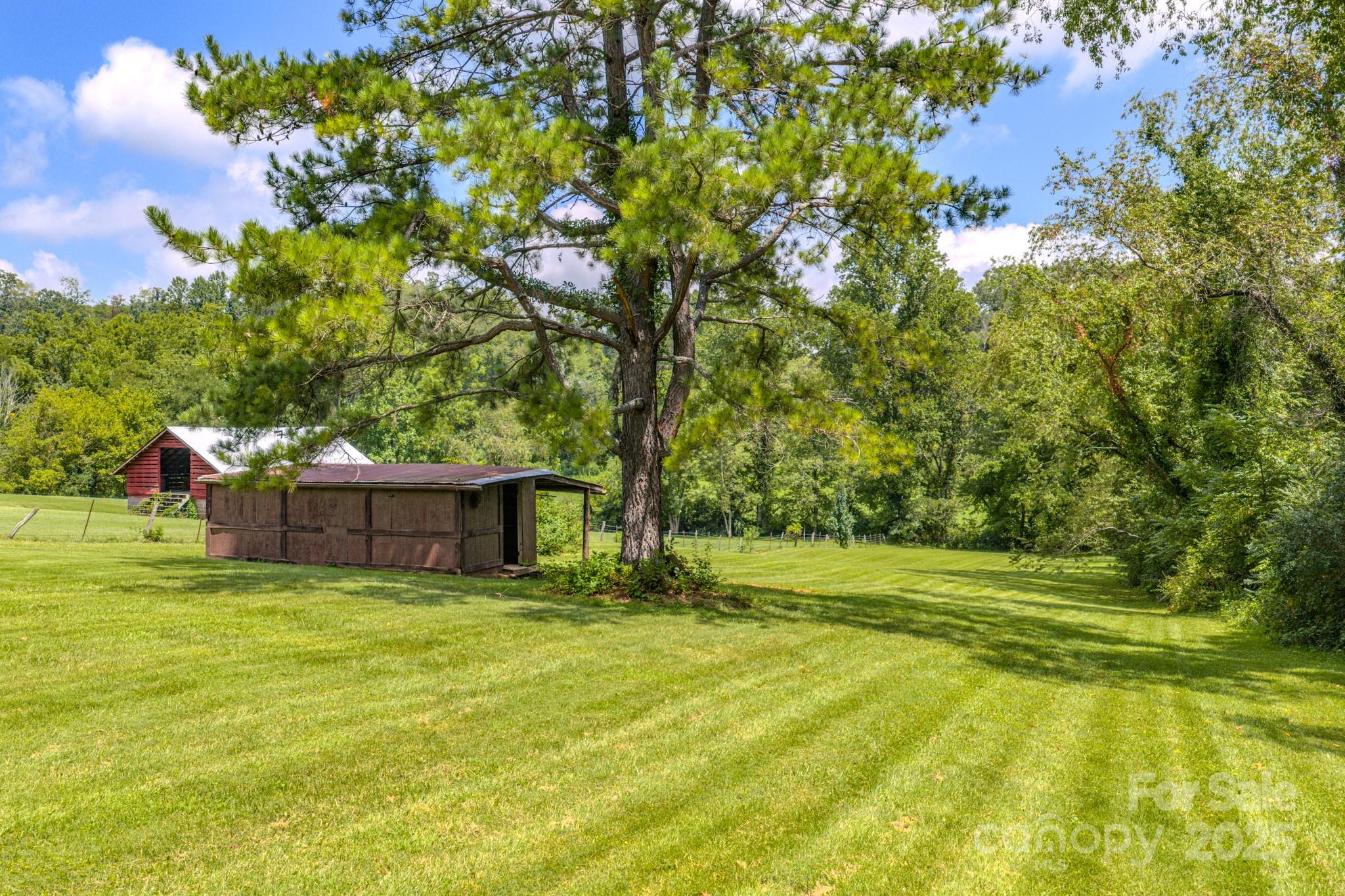26 Big Cove Road Candler, NC 28715 - Photo 41 of 47 a view of a house with a big yard