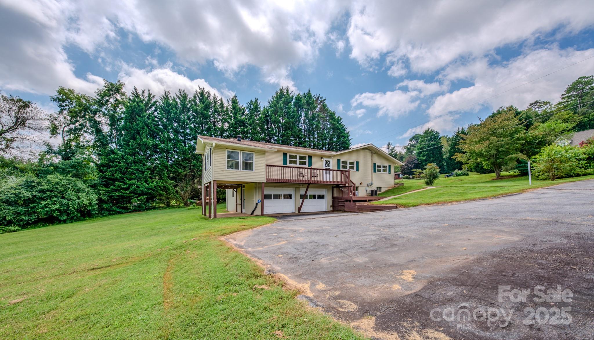 26 Big Cove Road Candler, NC 28715 - Photo 42 of 47 a view of a house with yard and sitting area