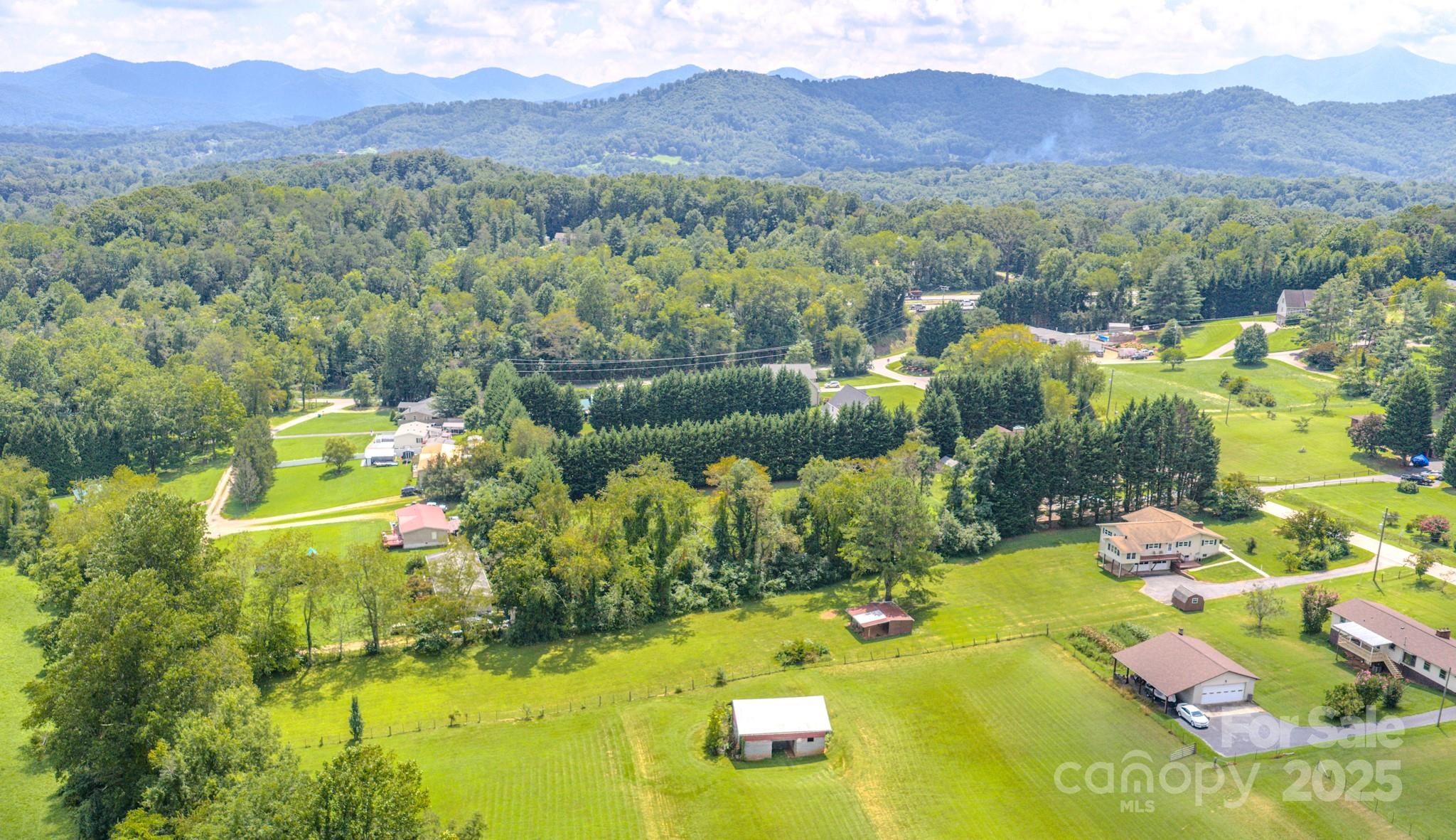 26 Big Cove Road Candler, NC 28715 - Photo 45 of 47 a view of a house with a garden