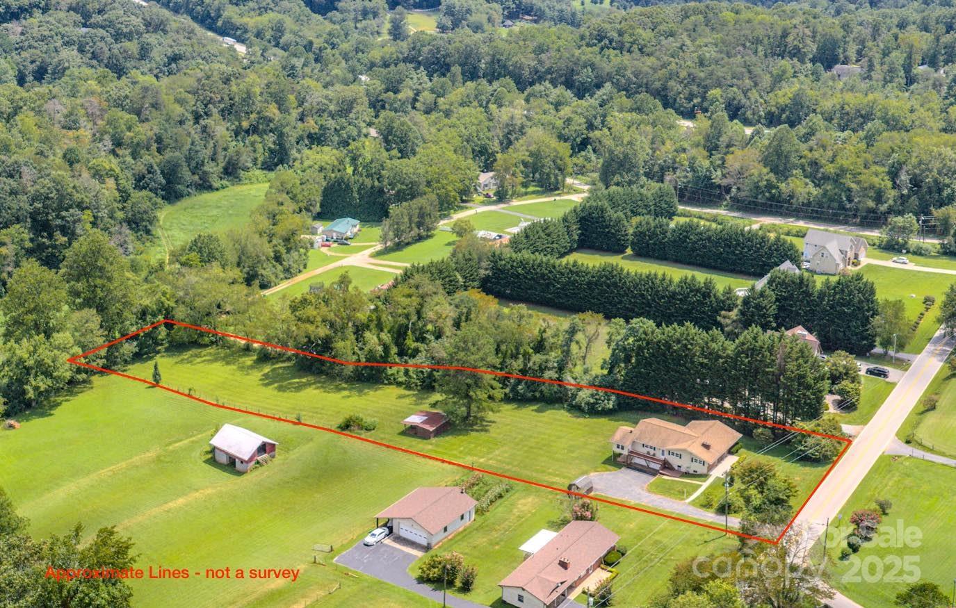 26 Big Cove Road Candler, NC 28715 - Photo 47 of 47 an aerial view of a golf course with chairs