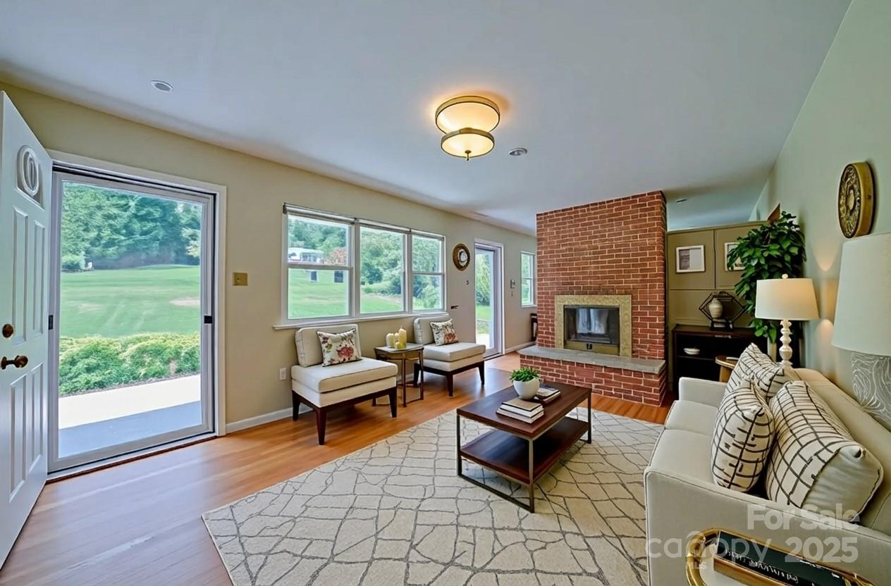 26 Big Cove Road Candler, NC 28715 - Photo 5 of 47 a living room with furniture and a fireplace
