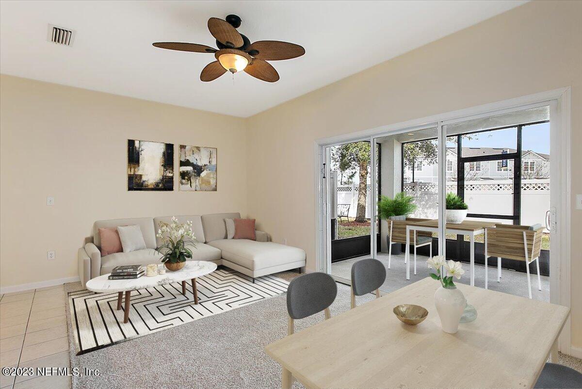 628 Crystal Way Orange Park, FL 32065 - Photo 1 of 21 a living room with furniture ceiling fan and a large window