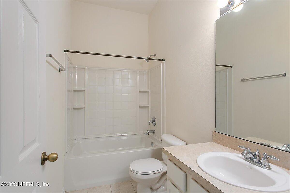 628 Crystal Way Orange Park, FL 32065 - Photo 12 of 21 a bathroom with a sink toilet and shower