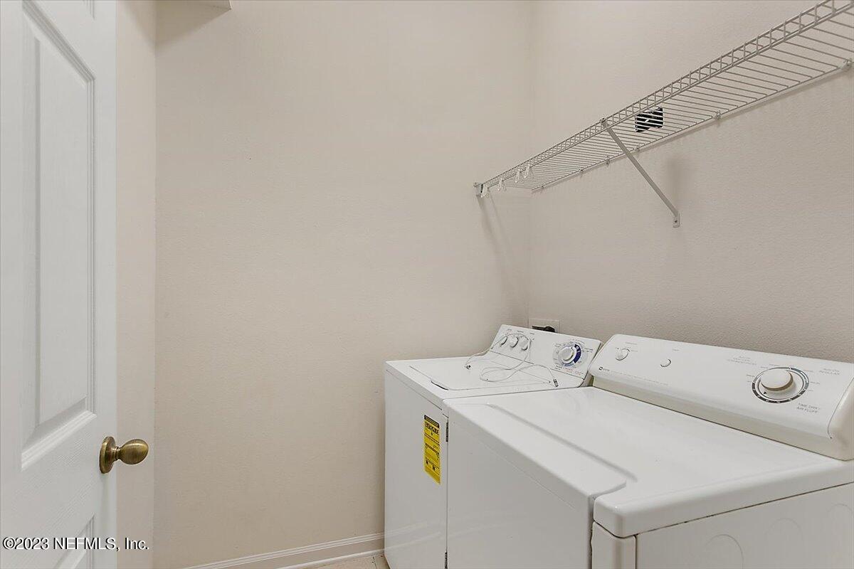 628 Crystal Way Orange Park, FL 32065 - Photo 14 of 21 a utility room with dryer and washer