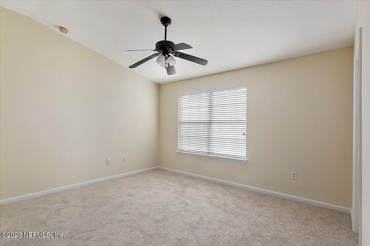 628 Crystal Way Orange Park, FL 32065 - Photo 18 of 21 a view of an empty room with a window