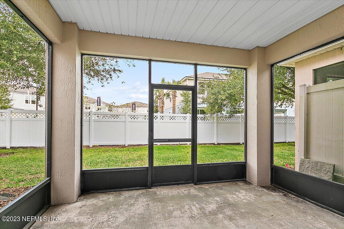 628 Crystal Way Orange Park, FL 32065 - Photo 20 of 21 a view of an empty room with wooden floor and a bed