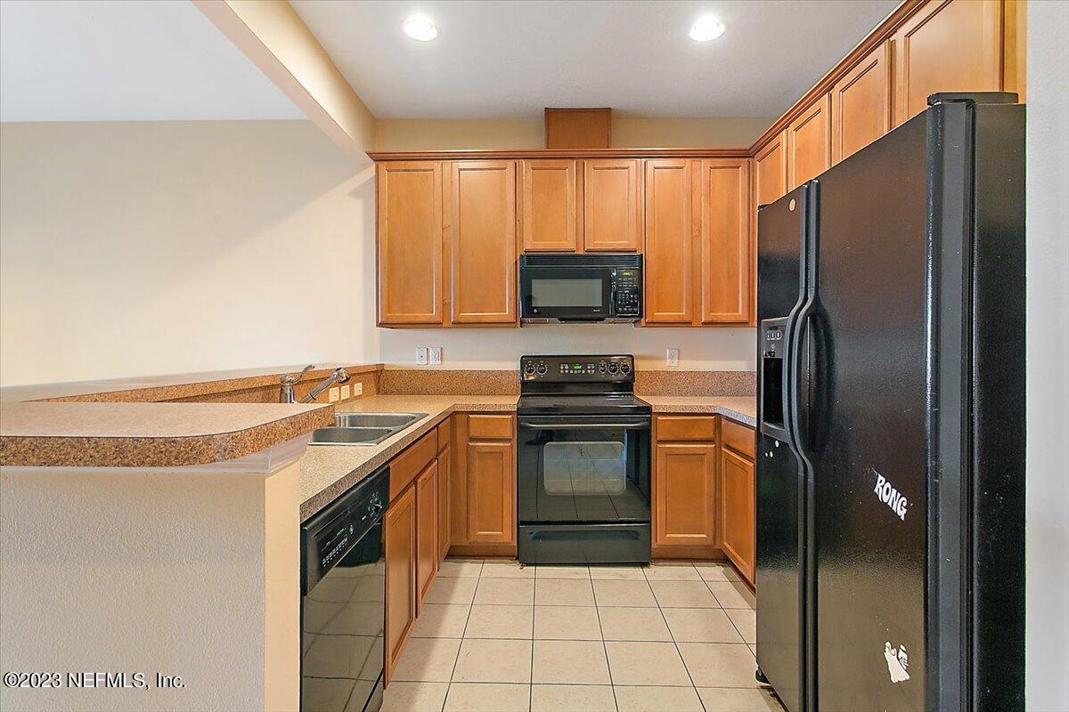 628 Crystal Way Orange Park, FL 32065 - Photo 5 of 21 a kitchen with a refrigerator sink and stove
