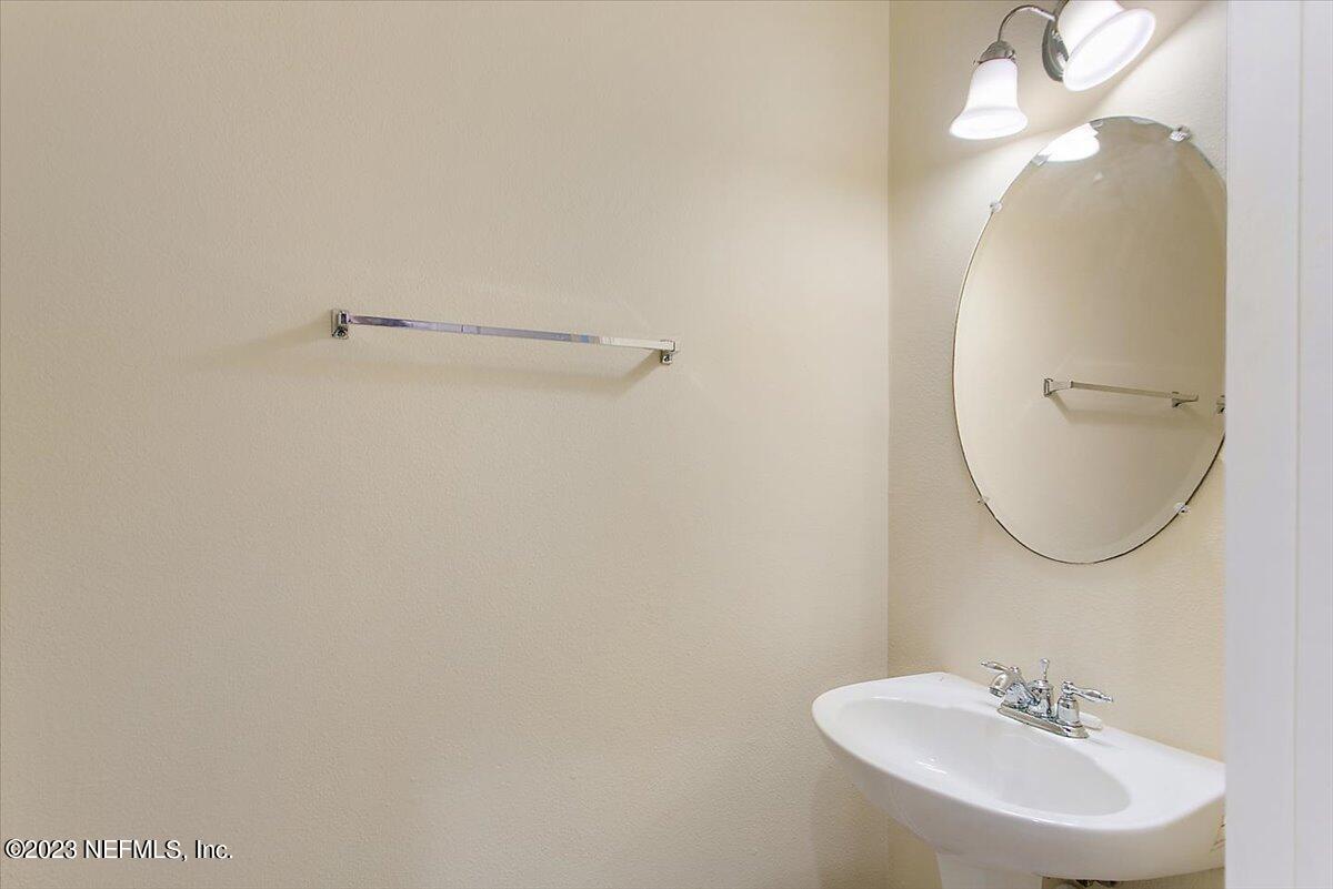 628 Crystal Way Orange Park, FL 32065 - Photo 7 of 21 a bathroom with a sink and mirror