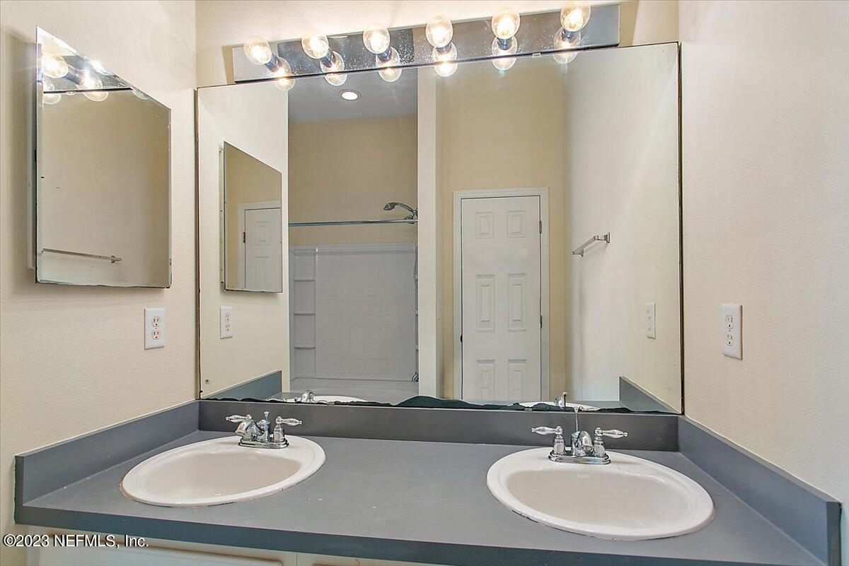628 Crystal Way Orange Park, FL 32065 - Photo 9 of 21 a bathroom with a sink and a mirror