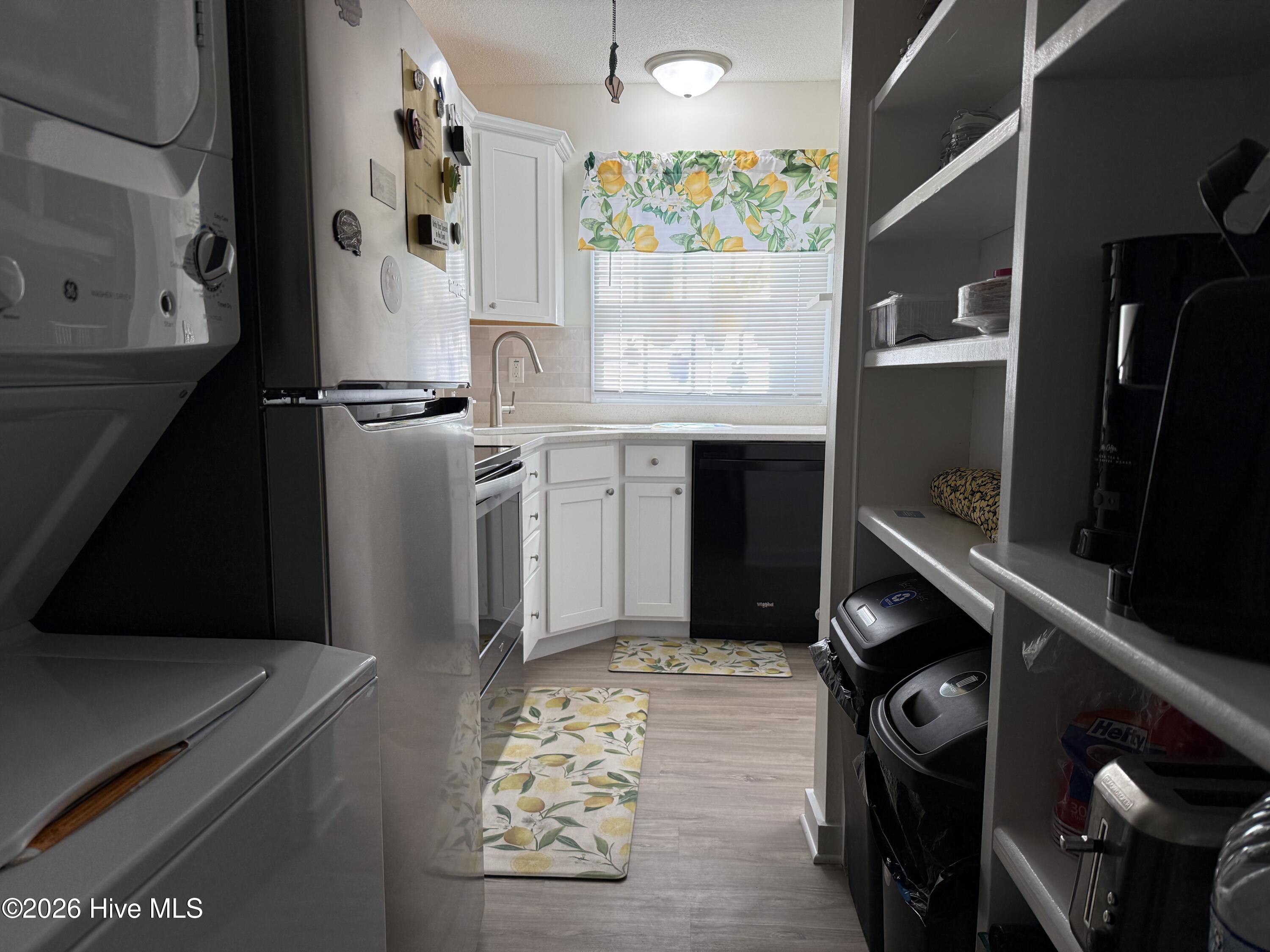 283 Salter Path Road, Unit 115 Pine Knoll Shores, NC 28512 - Photo 2 of 15 Kitchen/Laundry