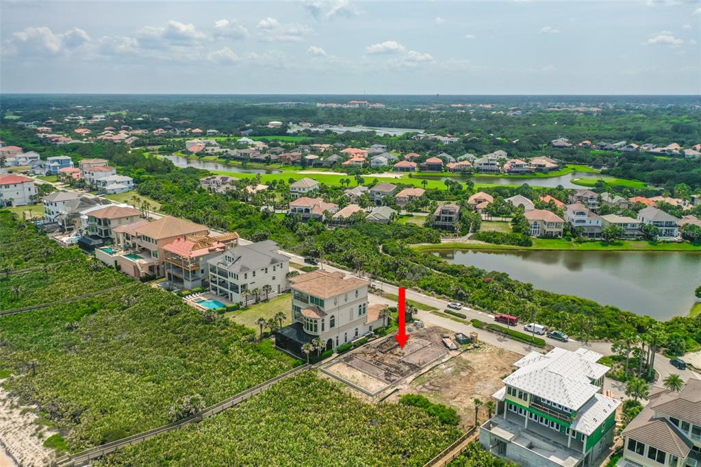 52 Ocean Ridge Boulevard Palm Coast, FL 32137 - Photo 23 of 36 an aerial view of residential houses with outdoor space and river