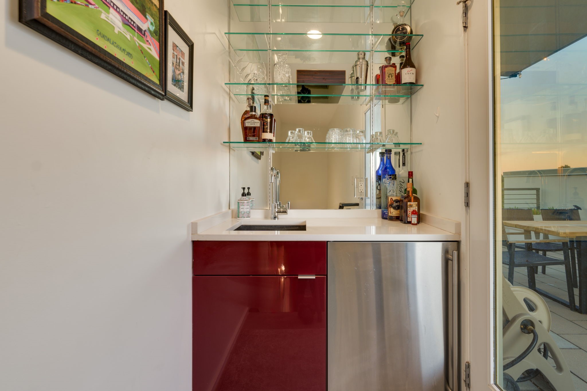2301 South 5th Street, Unit 5 Austin, TX 78704 - Photo 31 of 39 Bar featuring a sink and a stainless steel fridge with rooftop access to the patio area.
