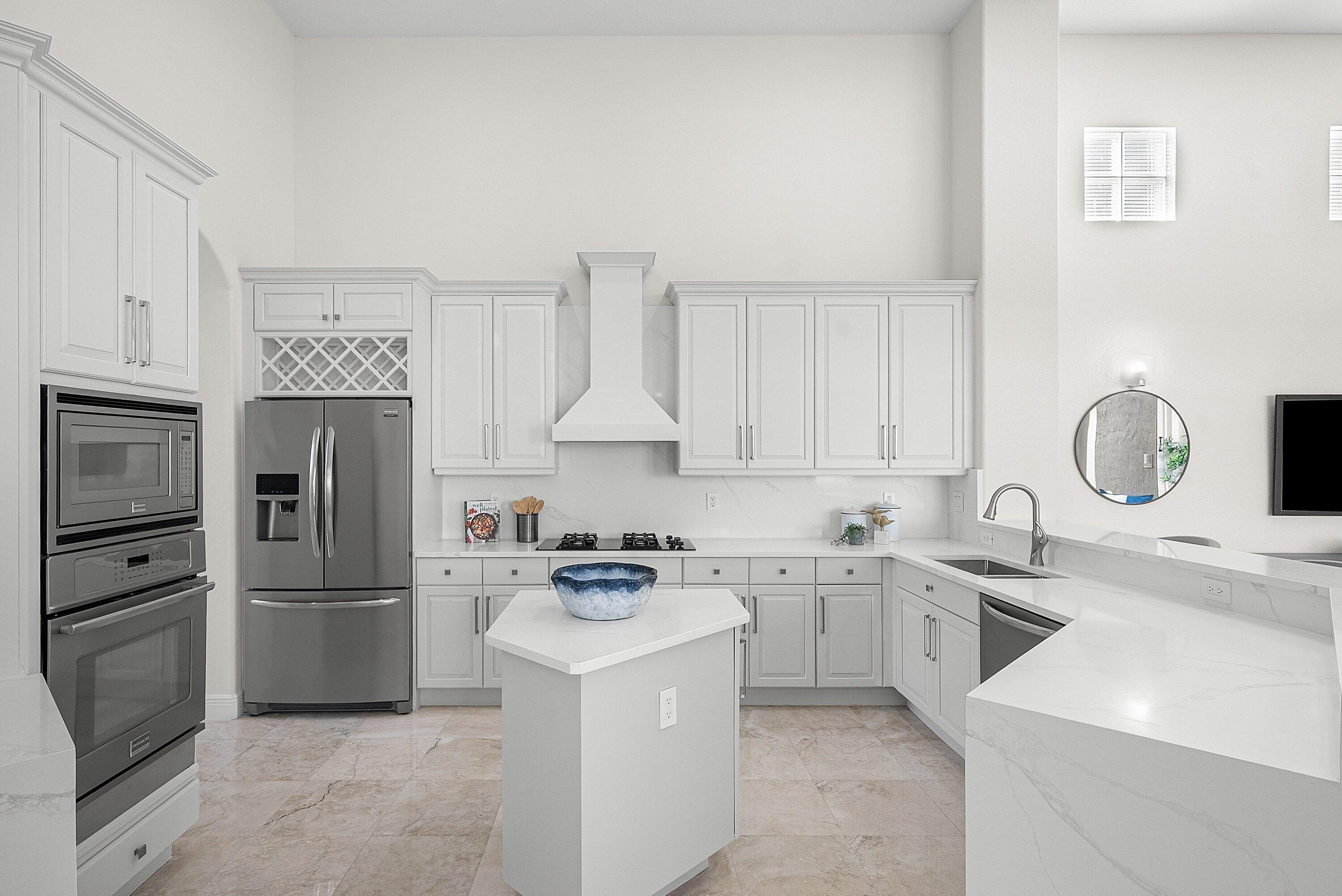 6468 Polo Pointe Way Delray Beach, FL 33484 - Photo 13 of 89 a kitchen with a sink appliances and cabinets